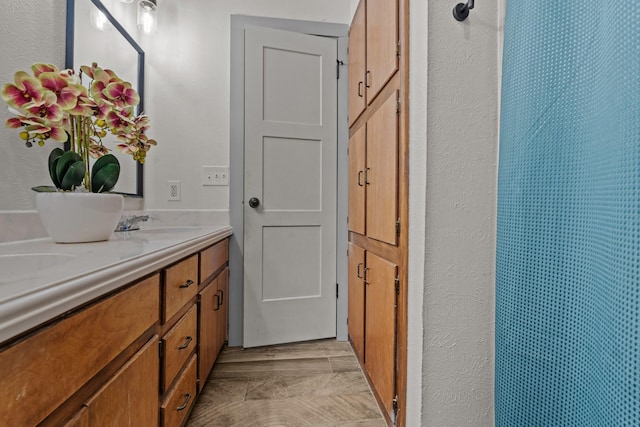 bathroom with vanity and a shower with shower curtain