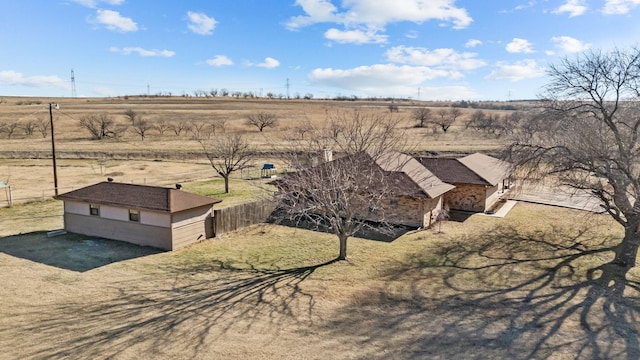 birds eye view of property with a rural view