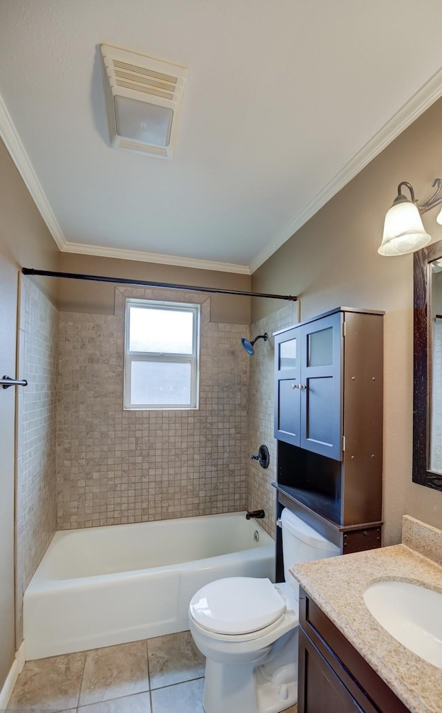 full bathroom featuring tile patterned floors, toilet, tiled shower / bath, ornamental molding, and vanity