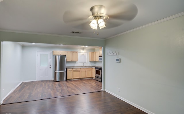 kitchen with dark wood-type flooring, light brown cabinetry, sink, ornamental molding, and stainless steel appliances