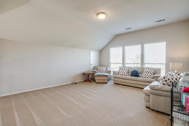 carpeted living room featuring lofted ceiling