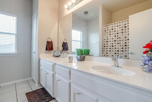 bathroom with a shower with curtain, tile patterned floors, and vanity