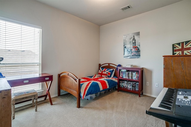 bedroom with light carpet