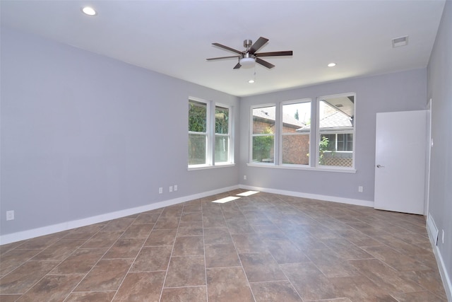 unfurnished room featuring ceiling fan