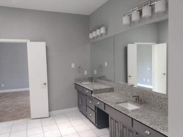 bathroom with tile patterned floors and vanity