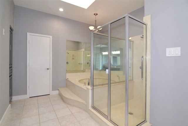 bathroom featuring plus walk in shower and tile patterned flooring