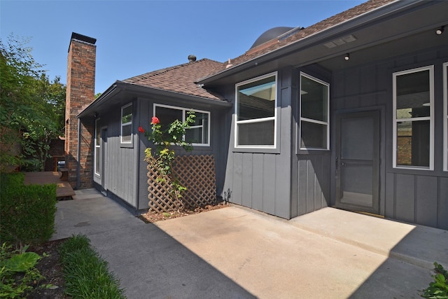 view of side of home featuring a patio area