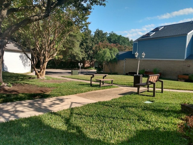 view of community with a yard