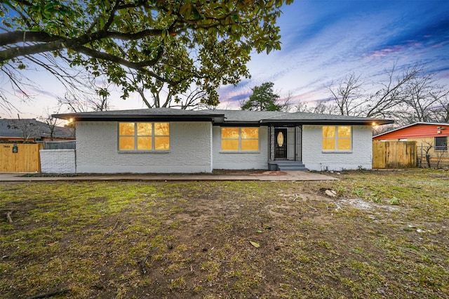 view of front of home with a yard