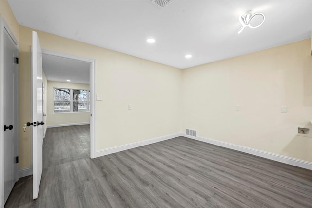 empty room with hardwood / wood-style floors