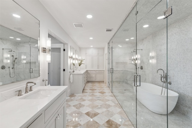 bathroom featuring vanity and independent shower and bath