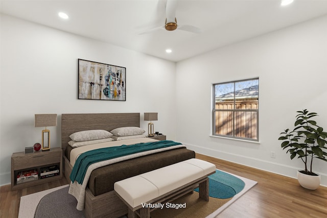 bedroom featuring hardwood / wood-style floors and ceiling fan