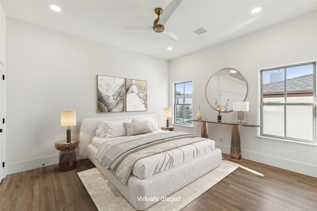 bedroom with ceiling fan and dark hardwood / wood-style flooring