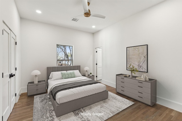 bedroom featuring ceiling fan and dark hardwood / wood-style flooring