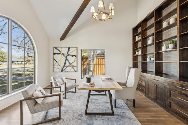 office with wood-type flooring, a chandelier, beamed ceiling, and high vaulted ceiling