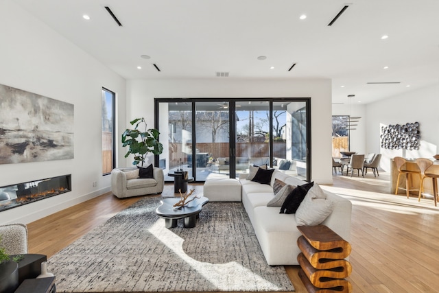 living room with light hardwood / wood-style floors