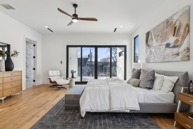 bedroom with wood-type flooring, access to exterior, and ceiling fan