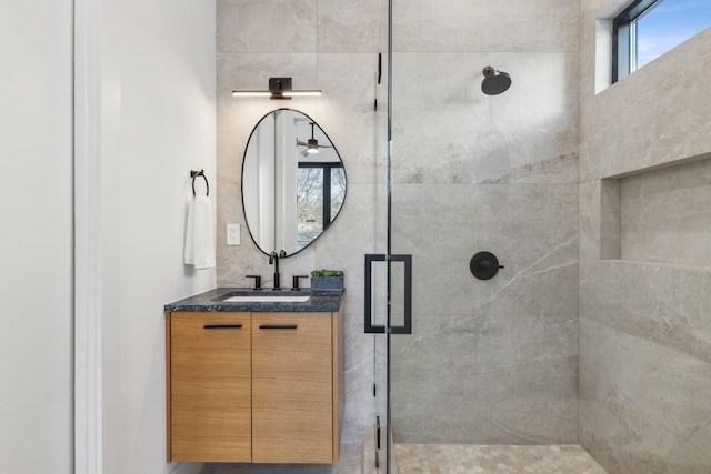 bathroom featuring vanity and an enclosed shower