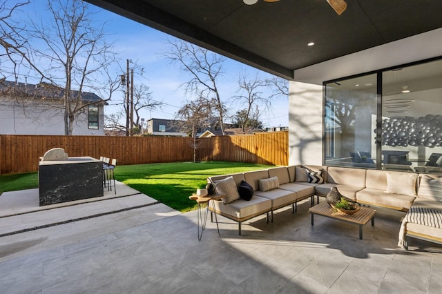 view of patio / terrace featuring an outdoor living space and ceiling fan