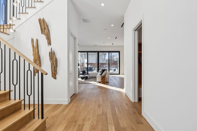 foyer with light hardwood / wood-style floors