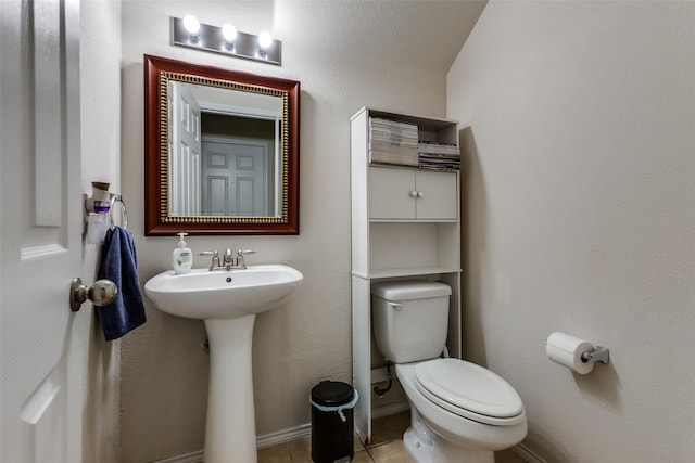 bathroom with sink, tile patterned floors, and toilet