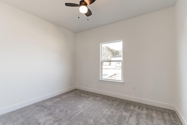 unfurnished room with ceiling fan and carpet flooring