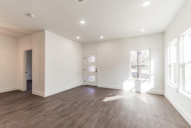 spare room featuring dark hardwood / wood-style floors