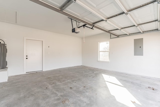 garage featuring a garage door opener, electric panel, and electric water heater