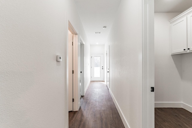 hall with dark hardwood / wood-style floors