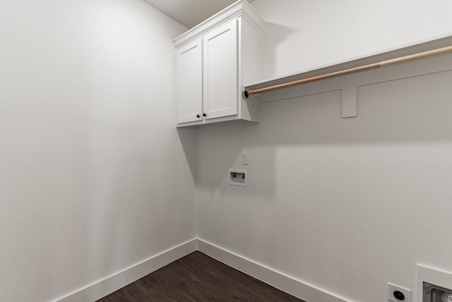 clothes washing area featuring cabinets, hookup for an electric dryer, dark hardwood / wood-style flooring, and hookup for a washing machine