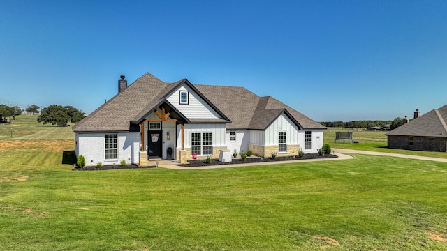 view of front of home with a front lawn