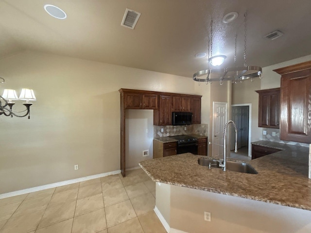 kitchen with black appliances, lofted ceiling, decorative backsplash, sink, and light tile patterned flooring