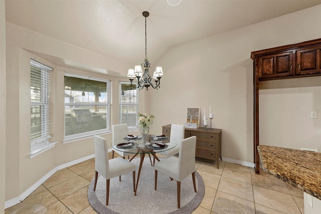 dining room with light tile patterned floors, a chandelier, and lofted ceiling