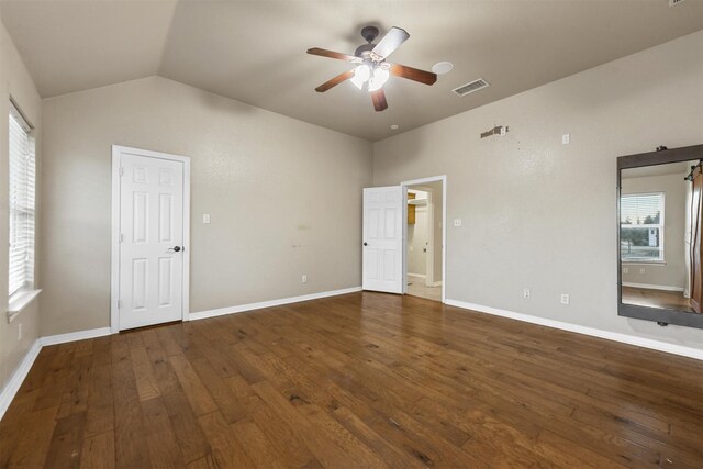 exterior space with a garage, central AC unit, and a lawn