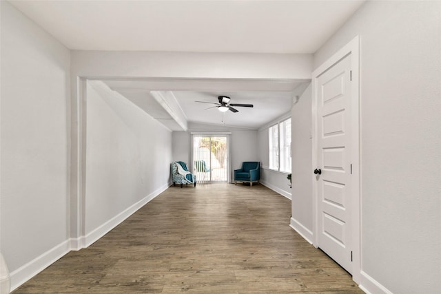 unfurnished room with ceiling fan and dark hardwood / wood-style flooring