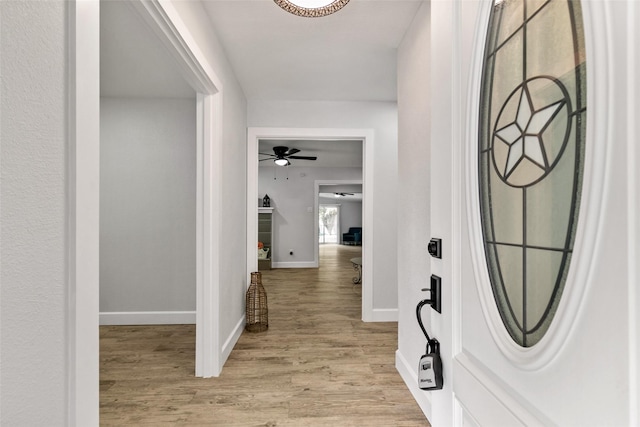 hall with light wood-type flooring