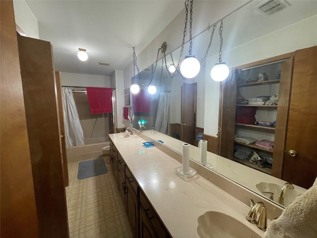 full bathroom featuring vanity, toilet, and shower / tub combo with curtain