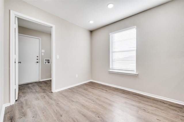 spare room featuring light hardwood / wood-style floors