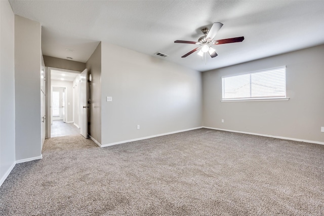 carpeted empty room with ceiling fan