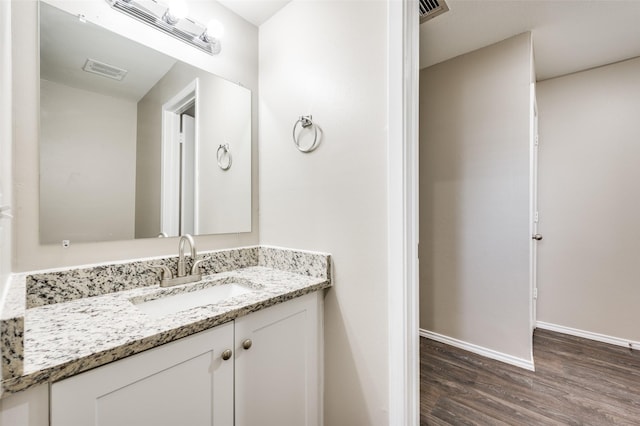 bathroom with wood-type flooring and vanity