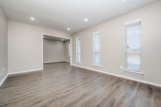 empty room featuring hardwood / wood-style floors and a wealth of natural light