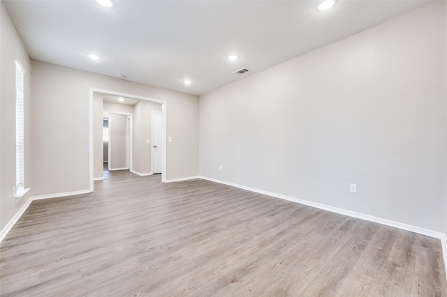 spare room featuring light hardwood / wood-style flooring