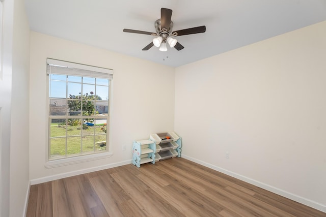 unfurnished room featuring hardwood / wood-style floors and ceiling fan