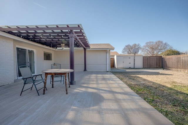 view of patio / terrace featuring a shed and a pergola