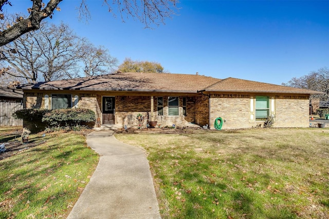 ranch-style home with a front lawn