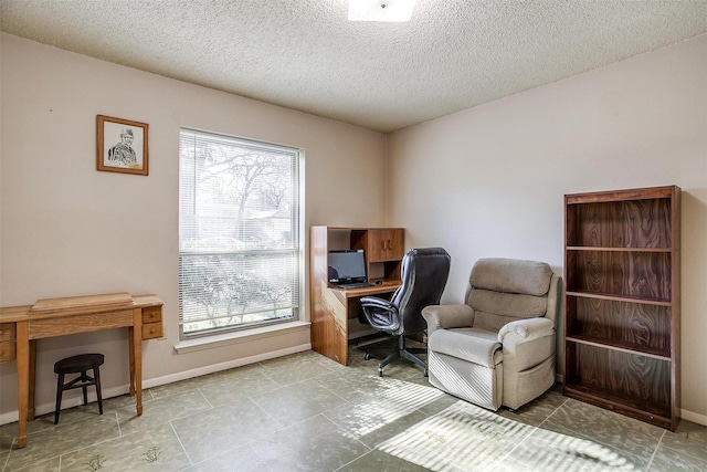 office space with a textured ceiling