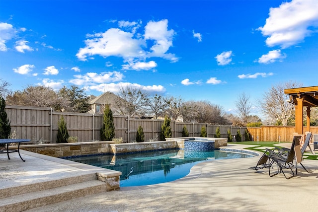 view of pool featuring a patio area and an in ground hot tub