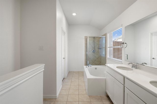 bathroom featuring vaulted ceiling, vanity, separate shower and tub, and tile patterned flooring