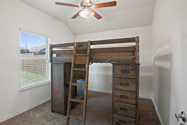 bedroom with ceiling fan, carpet floors, multiple windows, and lofted ceiling