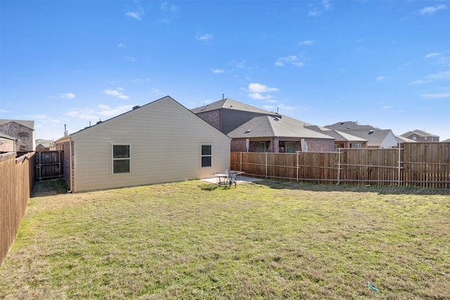 back of house featuring a yard